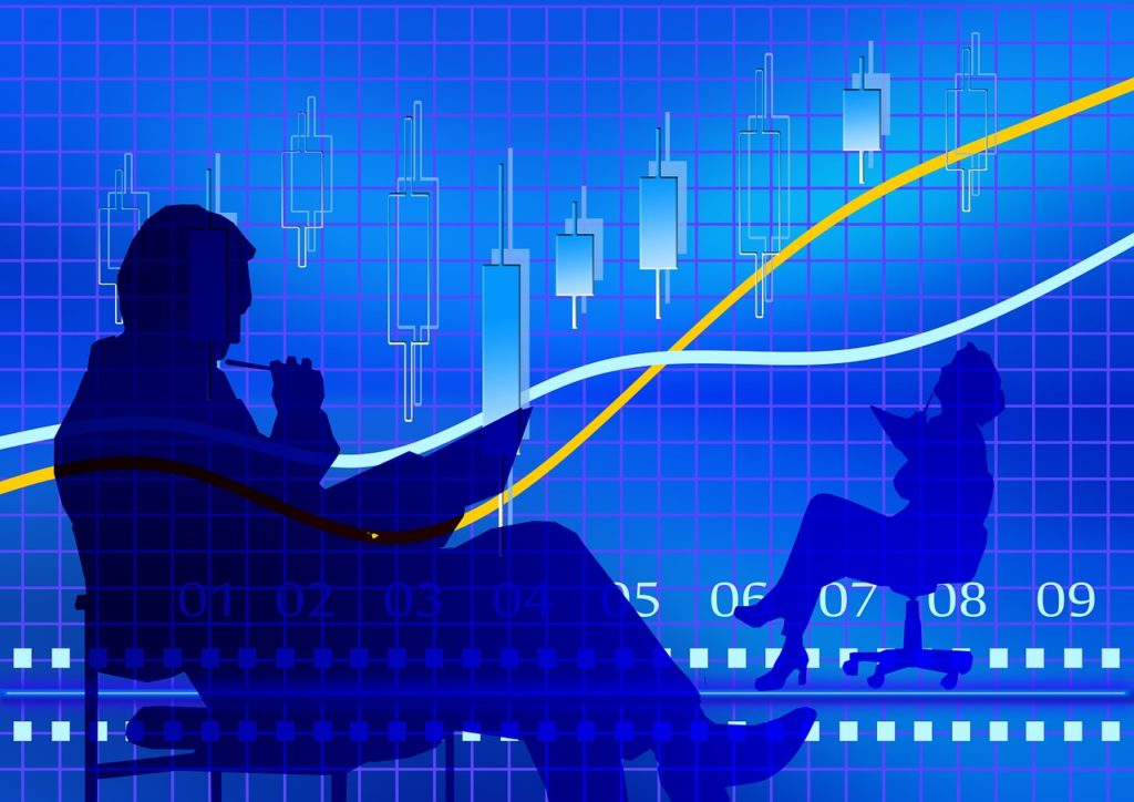 チャートと座っている人のシルエット